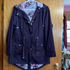 Jacket deep purple. Zips and has snap closer with hood. Waterproof.